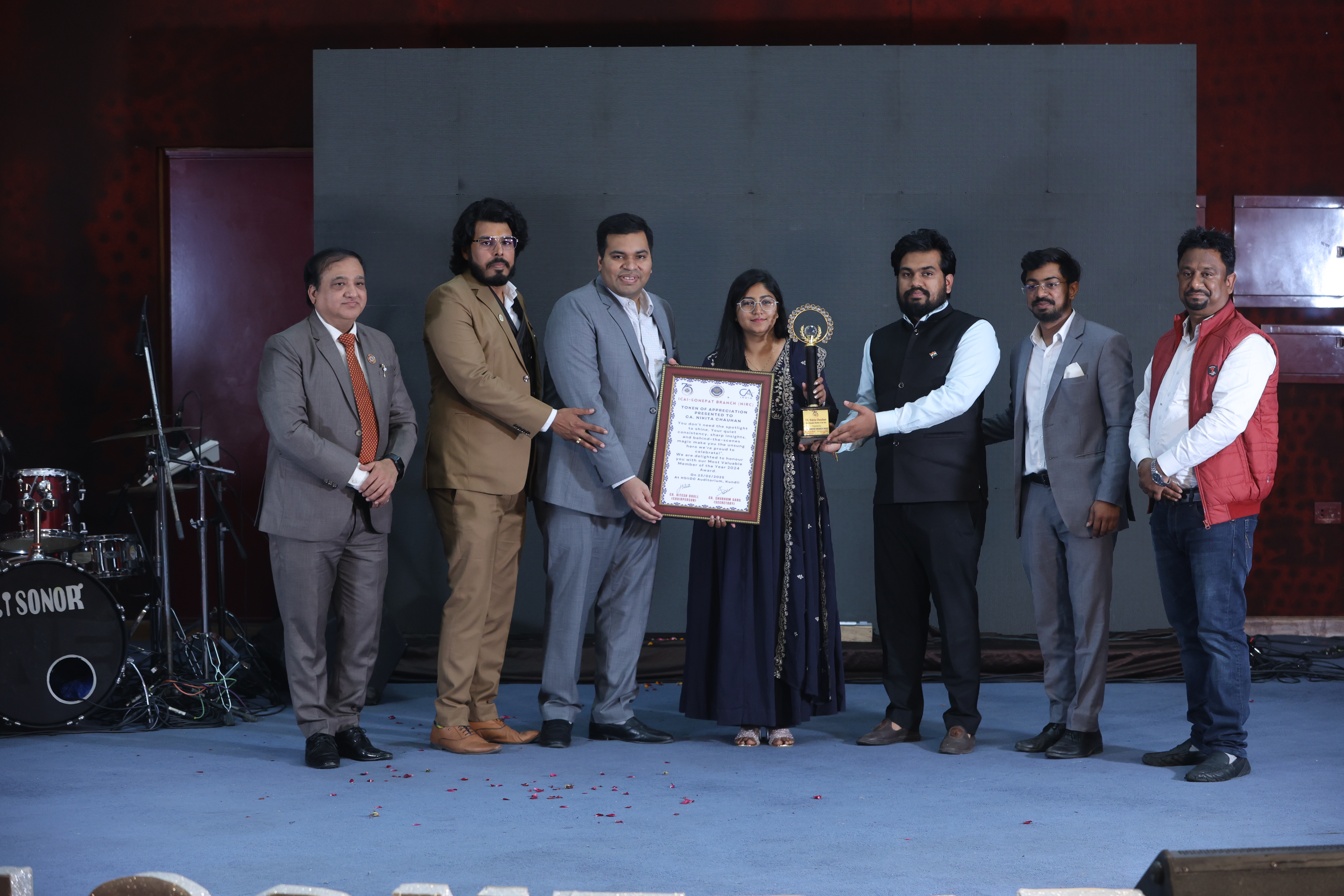 CA Nikita Chauhan getting Member (Female) of The Year Award by Sonepat Branch